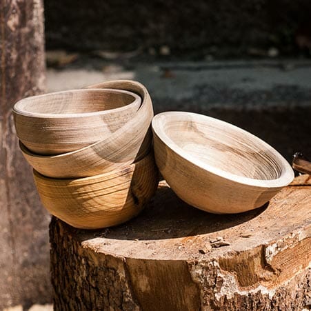 several wooden bowls stacked together